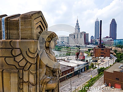 Cleveland's Guardian's of Transportations with Cleveland's downtown and industrial buildings Editorial Stock Photo