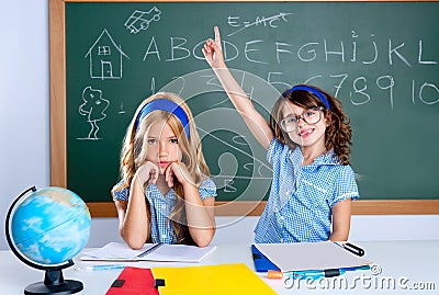 Clever nerd student girl in classroom raising hand Stock Photo