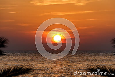 Cliche shot of red gradient sunset on water Stock Photo