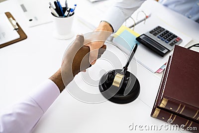 Client Lawyer Handshake In Courtroom Stock Photo