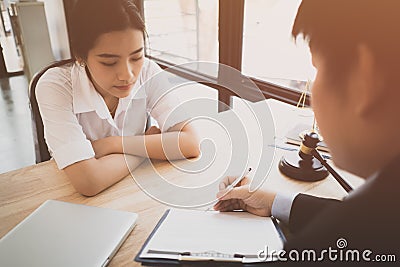 Client and lawyer have a sit down face to face meeting to discuss the legal Stock Photo