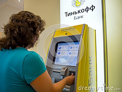 Client uses Tinkoff Bank self-service office Editorial Stock Photo