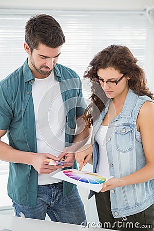Clients looking colour wheel together Stock Photo