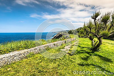 Cliff area in the resort town of Llanes, Spain Stock Photo