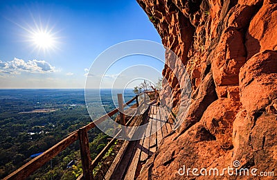 Cliff side wooden bridge at Wat Phu tok, Bueng Kan, Thailand Stock Photo