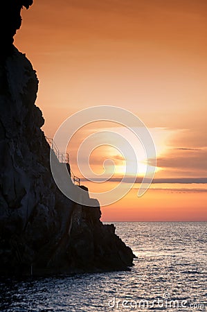 Cliff Strombolicchio, sunset, Italy Stock Photo