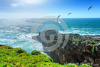 The cliffs on the coast of the Atlantic Ocean. Ocean waves, Casc Stock Photo