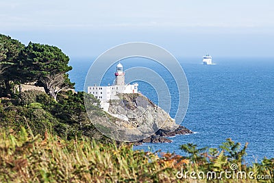 Cliffs in Howth and lighthouse, Ireland Stock Photo