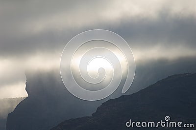 Cliffs of the Tejeda crater in the fog. Stock Photo