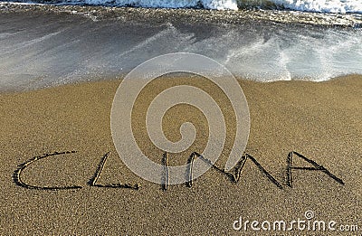 clima written in sand at the seaside Stock Photo