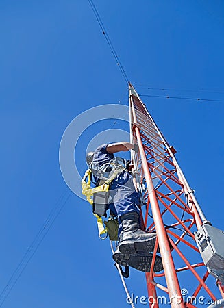 Climber on antenna tower Stock Photo