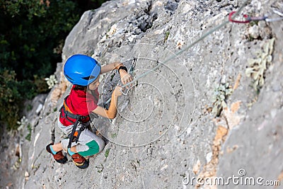 climber boy. the child trains in rock climbing Stock Photo