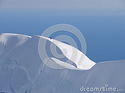 Climber on edge of crater of volcano Beerenberg Stock Photo