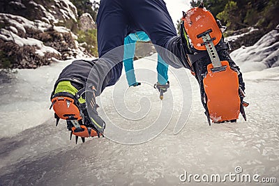 Climber on a frozen waterfall Stock Photo