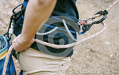 Climber belaying with rope and figure eight outdoor. Stock Photo