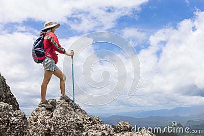 Climber standing on top of the mountain Stock Photo