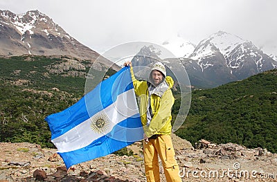 Climber waving a flag of Argentina Editorial Stock Photo