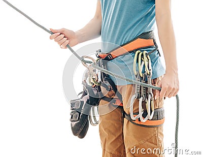 Climber woman in safety harness belaying with rope and figure eight. Stock Photo