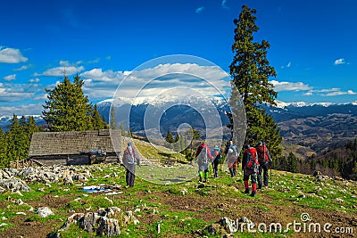 Climbers with equipment walking down from the mountain, Carpathians, Romania Editorial Stock Photo