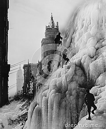 Climbers on glacier with skyscrapers in background Stock Photo