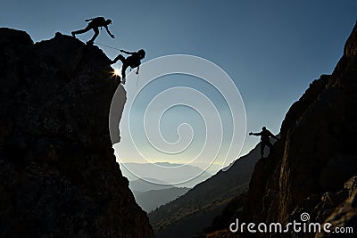 Climbers on mountain side Stock Photo