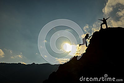 Climbers on peak Stock Photo