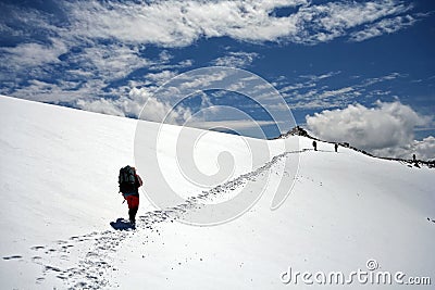 Climbers at the snow slope in Caucasus mountains Stock Photo