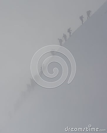 Climbers in snowstorm Stock Photo