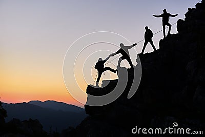 Climbers working together Stock Photo