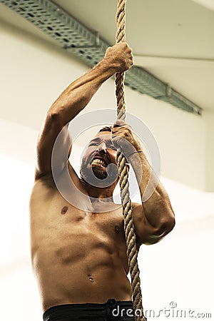 Climbiing with rope Stock Photo