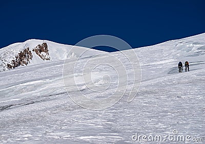 Climbing of alpinist in Caucasus mountains Stock Photo