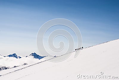 Climbing climbers on the snowy mountain top. Stock Photo