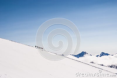 Climbing climbers on the snowy mountain top. Stock Photo