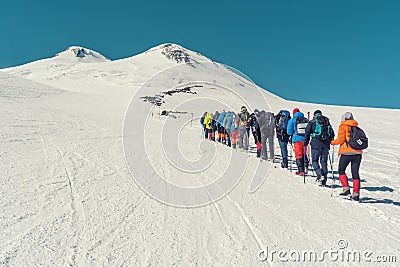 Climbing Elbrus group of climbers goes in the snow to the top. Editorial Stock Photo