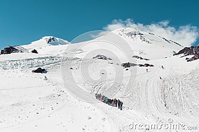 Climbing Elbrus group of climbers goes in the snow to the top. Stock Photo