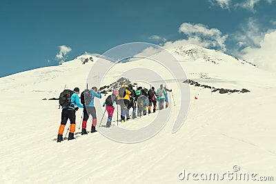 Climbing Elbrus group of climbers goes in the snow to the top. Stock Photo