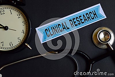 Clinical Research on the print paper with Healthcare Concept Inspiration. alarm clock, Black stethoscope. Stock Photo