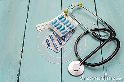 Clinical trial concept. Chalk board, stethoscope, pills Stock Photo