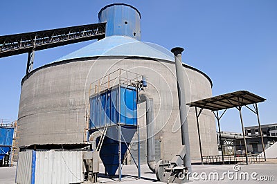 Clinker storage silo with a dust collector Stock Photo