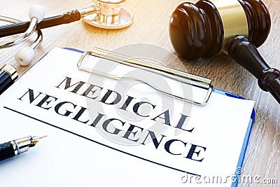 Documents about medical negligence on a table. Stock Photo