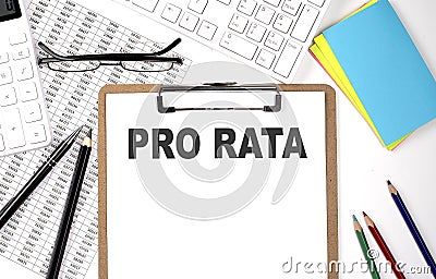 Clipboard with text PRO RATA and keyboard and chart on white background Stock Photo