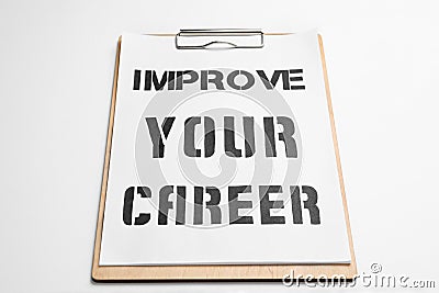 Clipboard with words IMPROVE YOUR CAREER on background Stock Photo