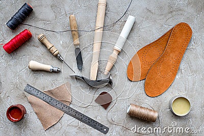 Clobber preparing his tools for work. Grey stone desk background top view Stock Photo