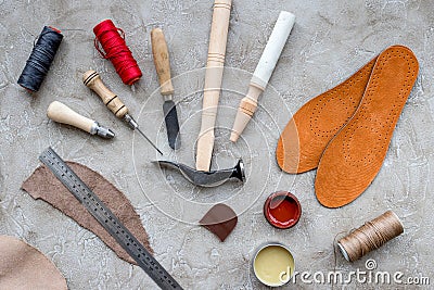 Clobber preparing his tools for work. Grey stone desk background top view Stock Photo