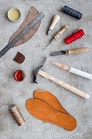 Clobber preparing his tools for work. Grey stone desk background top view Stock Photo