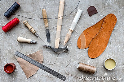 Clobber preparing his tools for work. Grey stone desk background top view Stock Photo