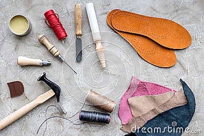 Clobber preparing his tools for work. Grey stone desk background top view Stock Photo