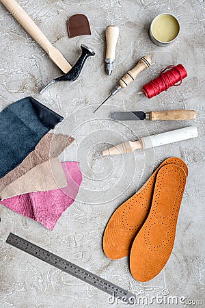 Clobber preparing his tools for work. Grey stone desk background top view Stock Photo