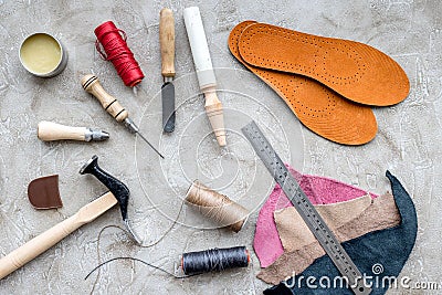 Clobber preparing his tools for work. Grey stone desk background top view Stock Photo