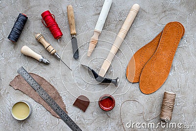 Clobber preparing his tools for work. Grey stone desk background top view Stock Photo